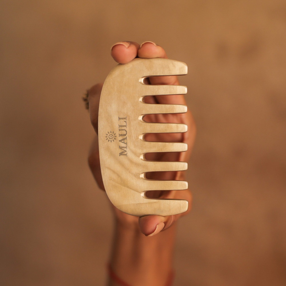 Mauli hair comb shown in hand